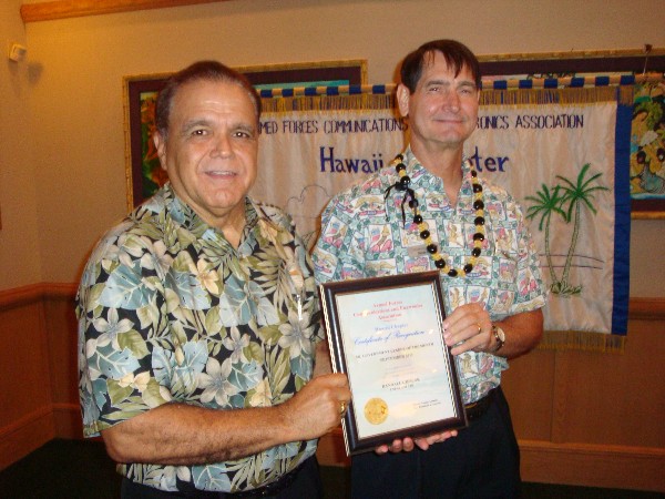 In September, Lindo (l) presents the chapter’s Senior Government Leader of the Month Award to Randall Cieslak, chief information officer, U.S. Pacific Command.